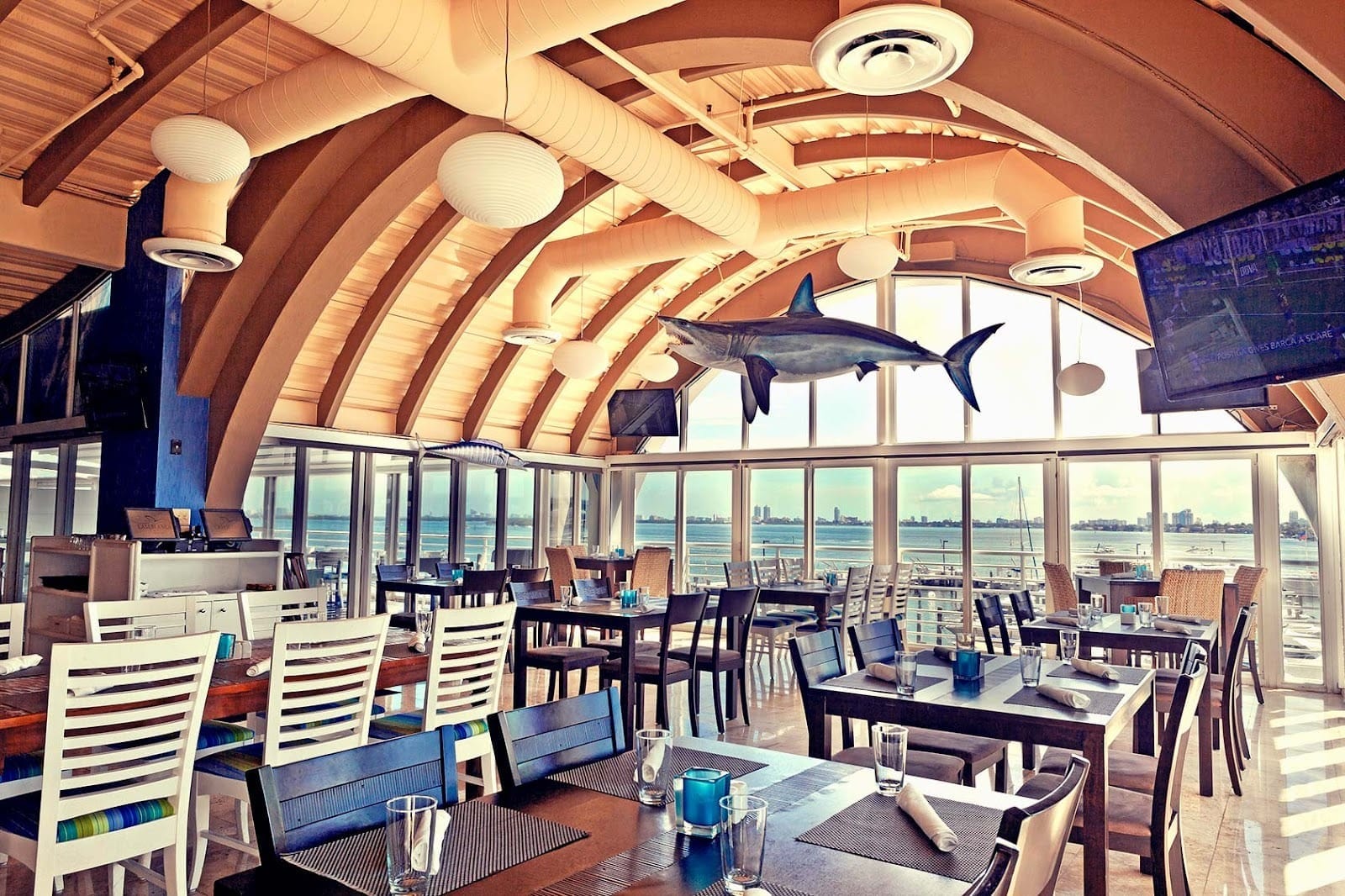 Interior of Casablanca on the Bay in Miami, featuring arched wooden ceilings, waterfront dining, and a dockside location for boaters.