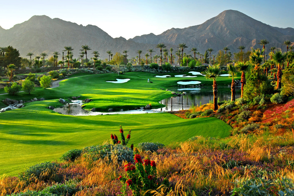 Indian Wells Golf Resort in California, featuring emerald greens, palm-lined fairways, and scenic water hazards with the Santa Rosa Mountains in the background. A top luxury golf destination in the Coachella Valley.