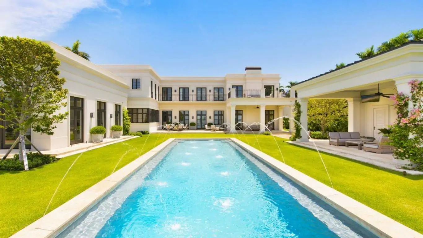 Villa Siren in Miami featuring a private pool, elegant architecture, lush gardens, and spacious outdoor lounge areas.