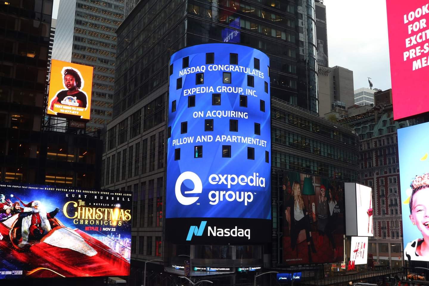 Nasdaq Board in Times Square reads: Nasdaq Congratulates Expedia Group, Inc. on acquiring Pillow and ApartmentJet