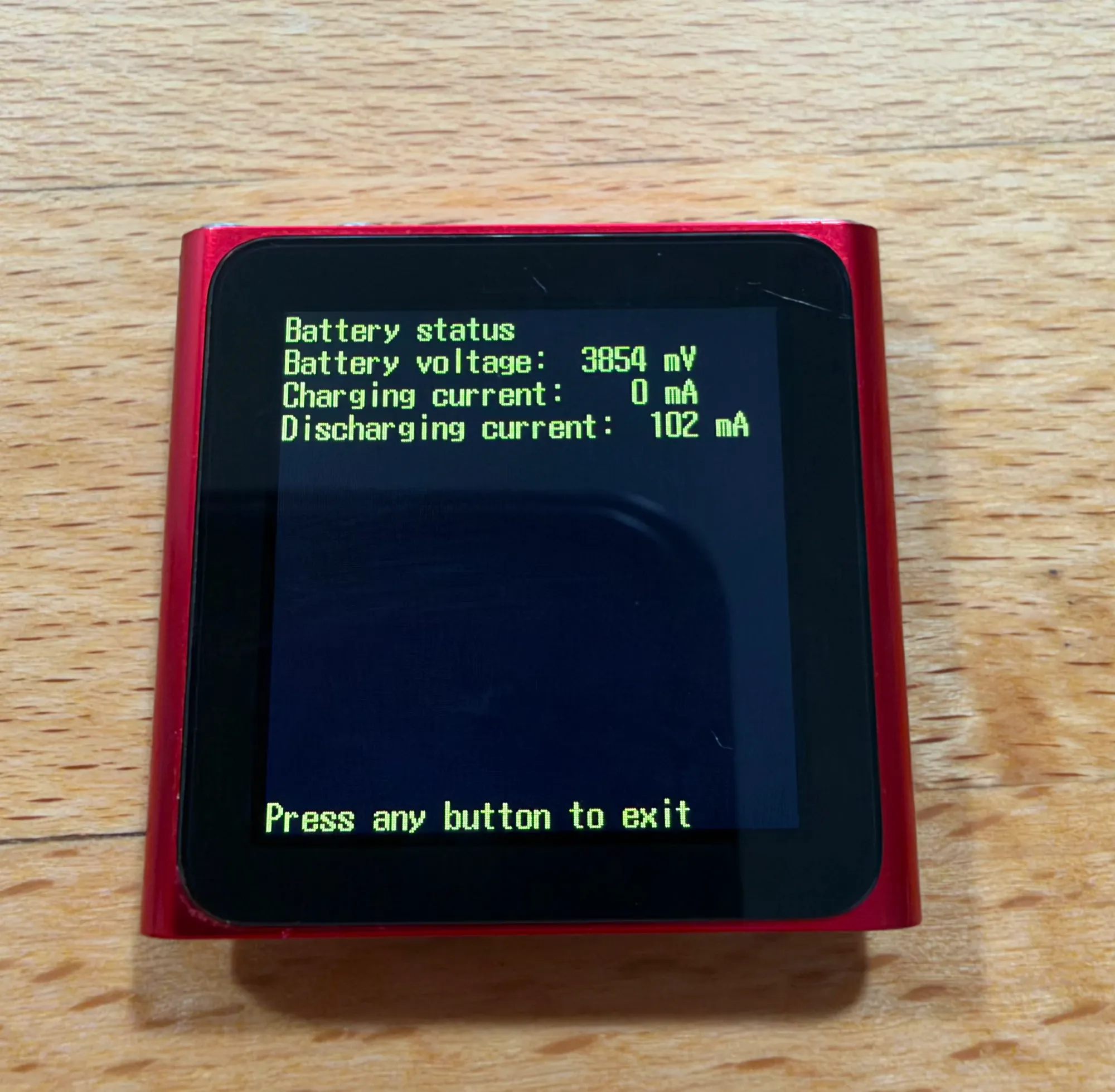 The iTerm output showing "Battery status", "Battery voltage", "Charging current", and "Discharging current".