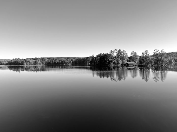 A cabin by a large lake