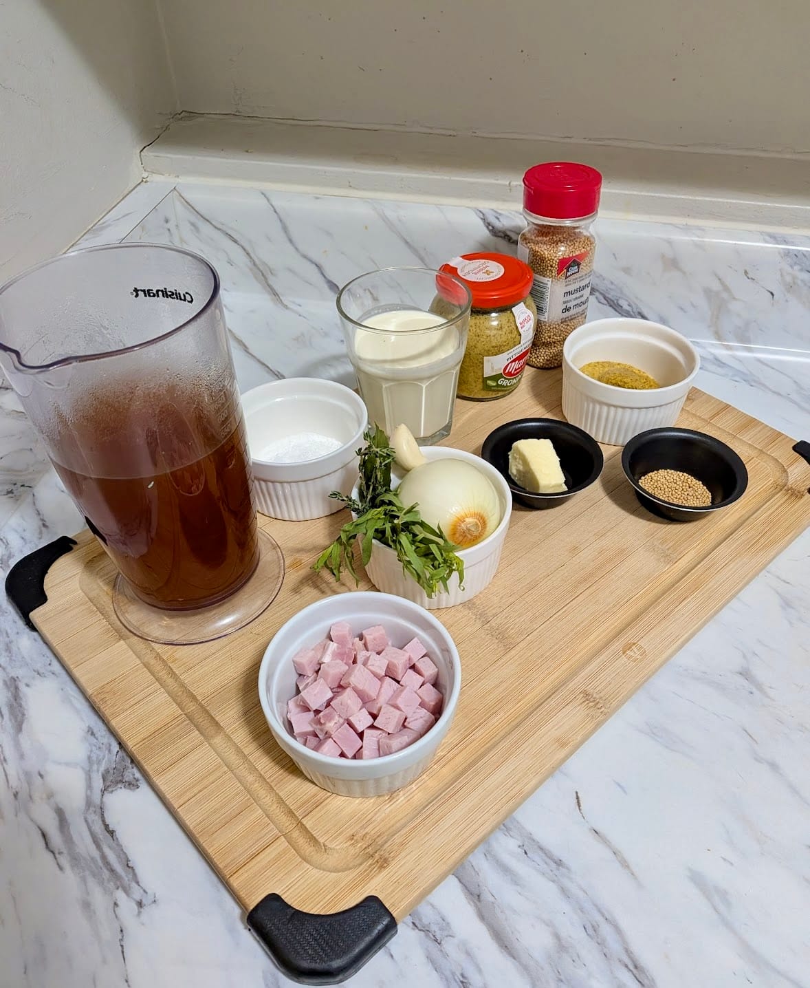 Portioned ingredients laid out on a bamboo cutting board for Dutch Mustard Soup