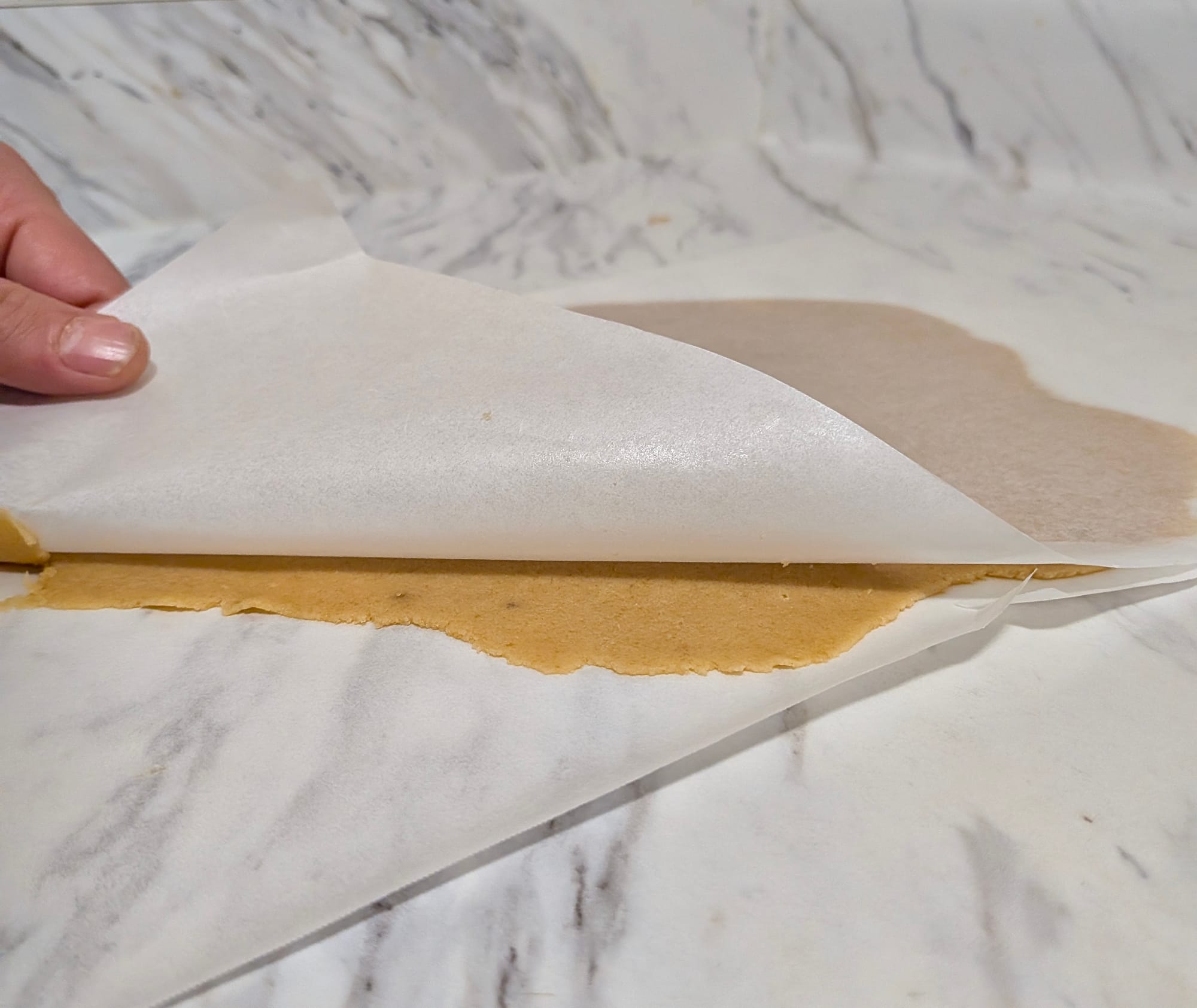 Craquelin rolled between two sheets of parchment paper.