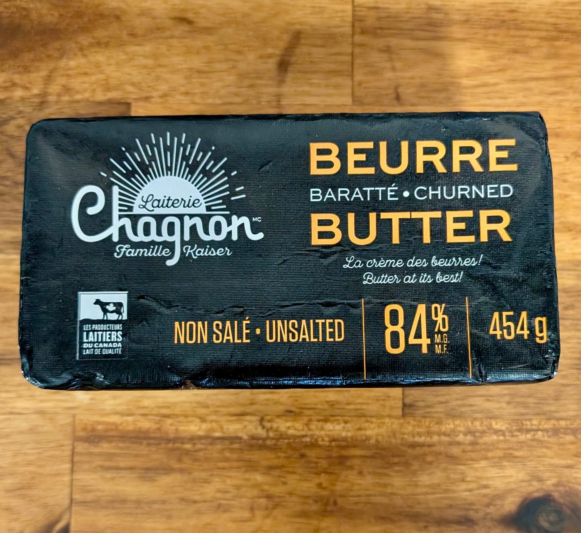A photo of the Chagnon Famille Kaiser Butter package - black with white and orange writing.