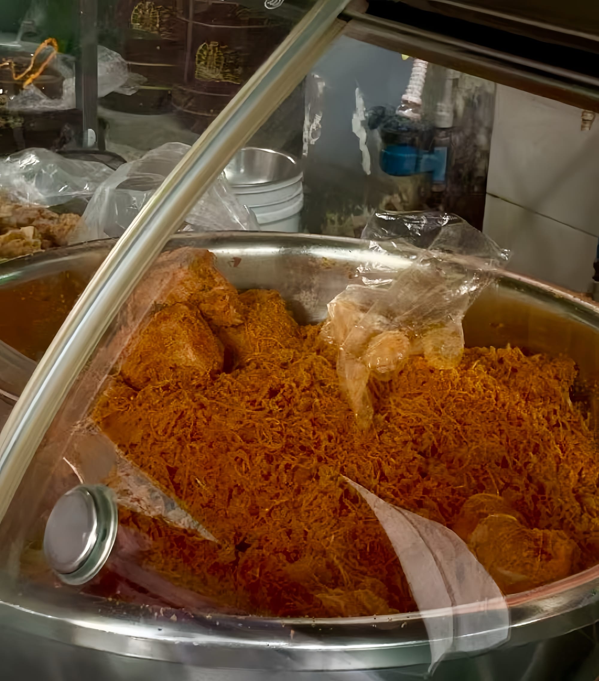 Zha in a bowl - shredded brownish-orange radish in a stainless steal bowl.