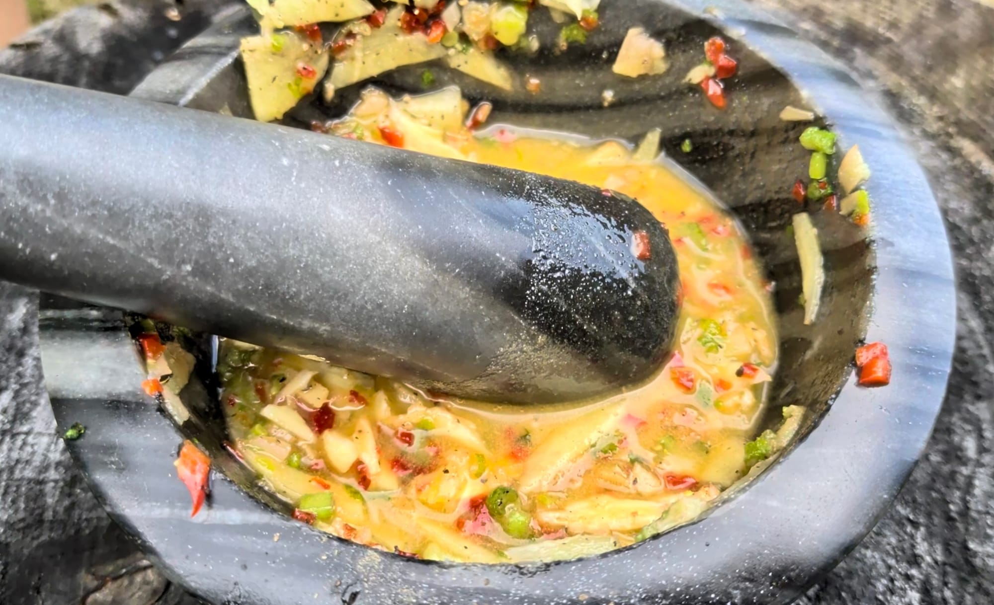 Mortar and pestle with mango achcharu
