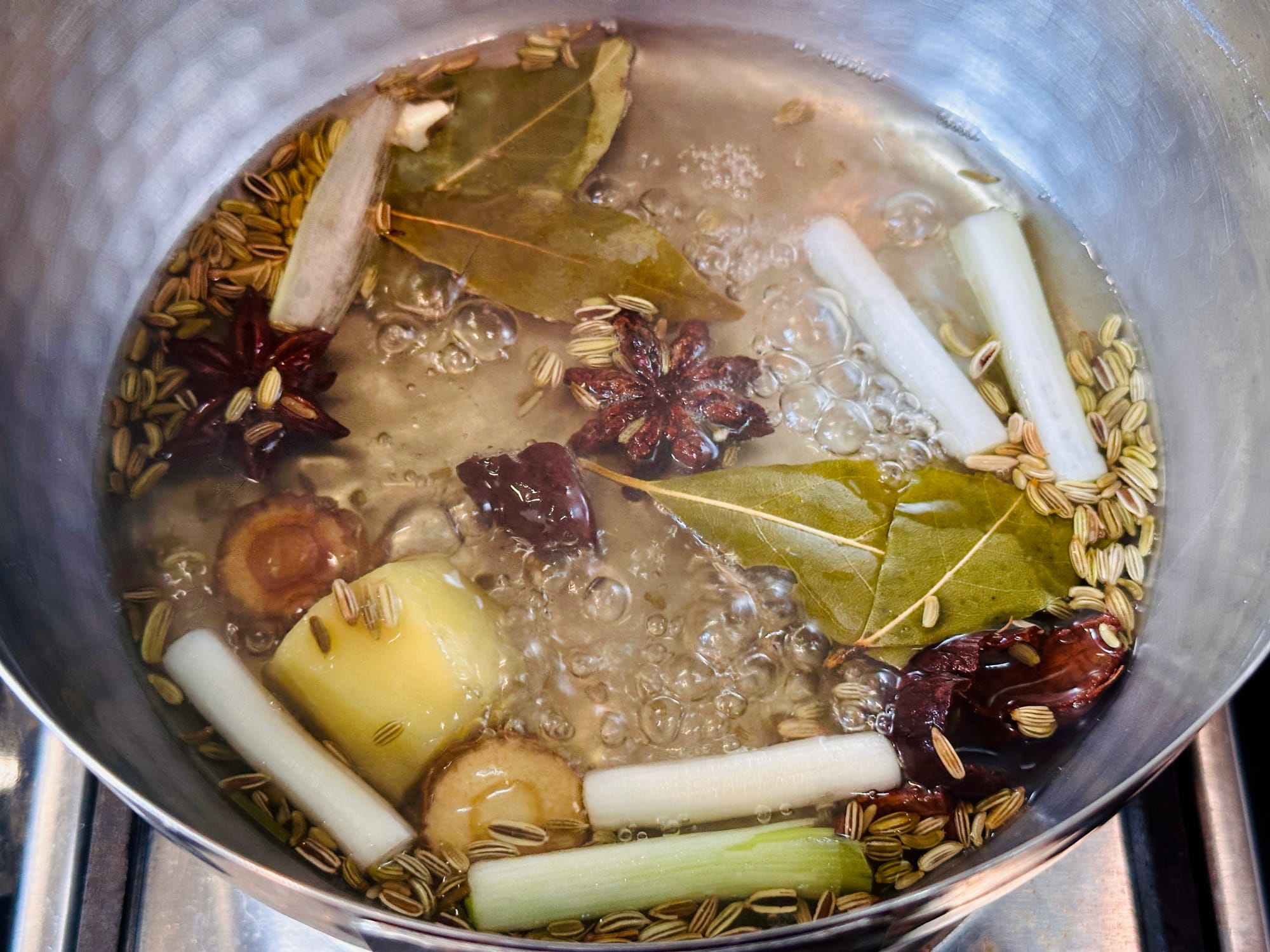 Ingredients for compound soy sauce being simmered in water.
