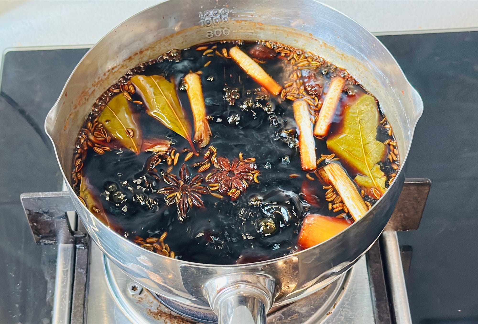Compound soy sauce simmering on a stove