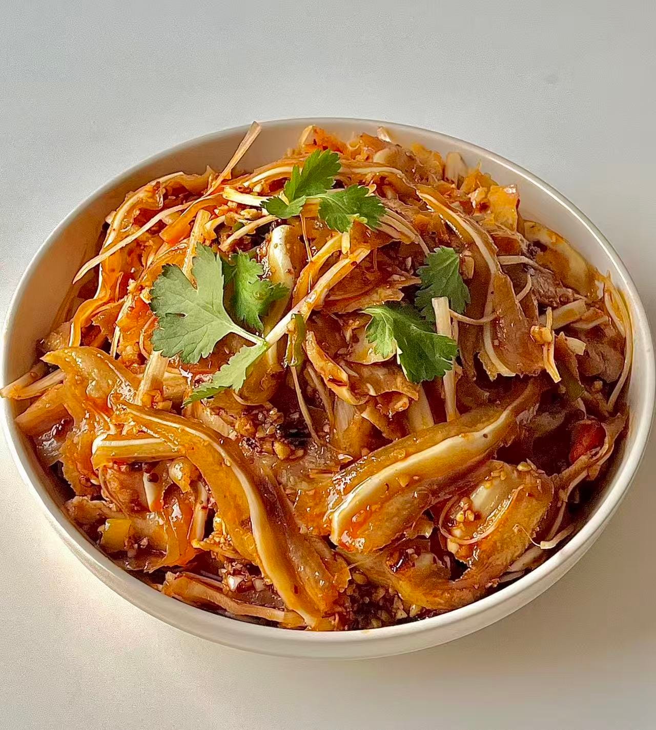 Diced pig ears covered in red chili oil