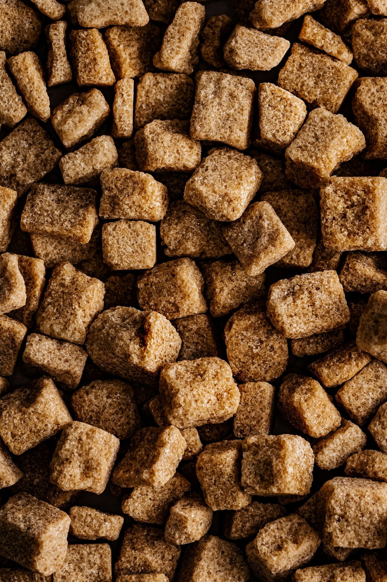 Malted brown sugar cubes close up.