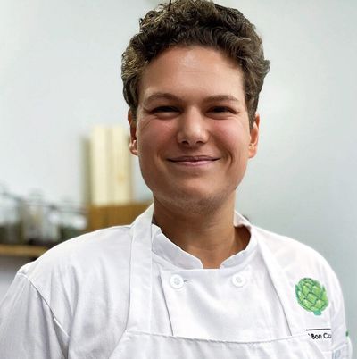 Arnold Kuiper - Instructional Chef at C'est Bon Ottawa posing in his chef's uniform.