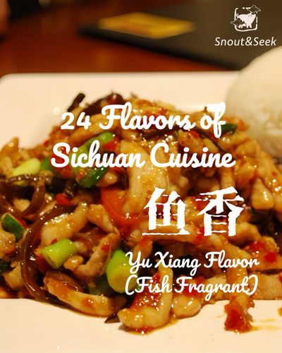 Shredded pork with mixed vegetables in a redish-orange sauce piled on a square white plate with a perfectly formed pile of rice in the top right corner.