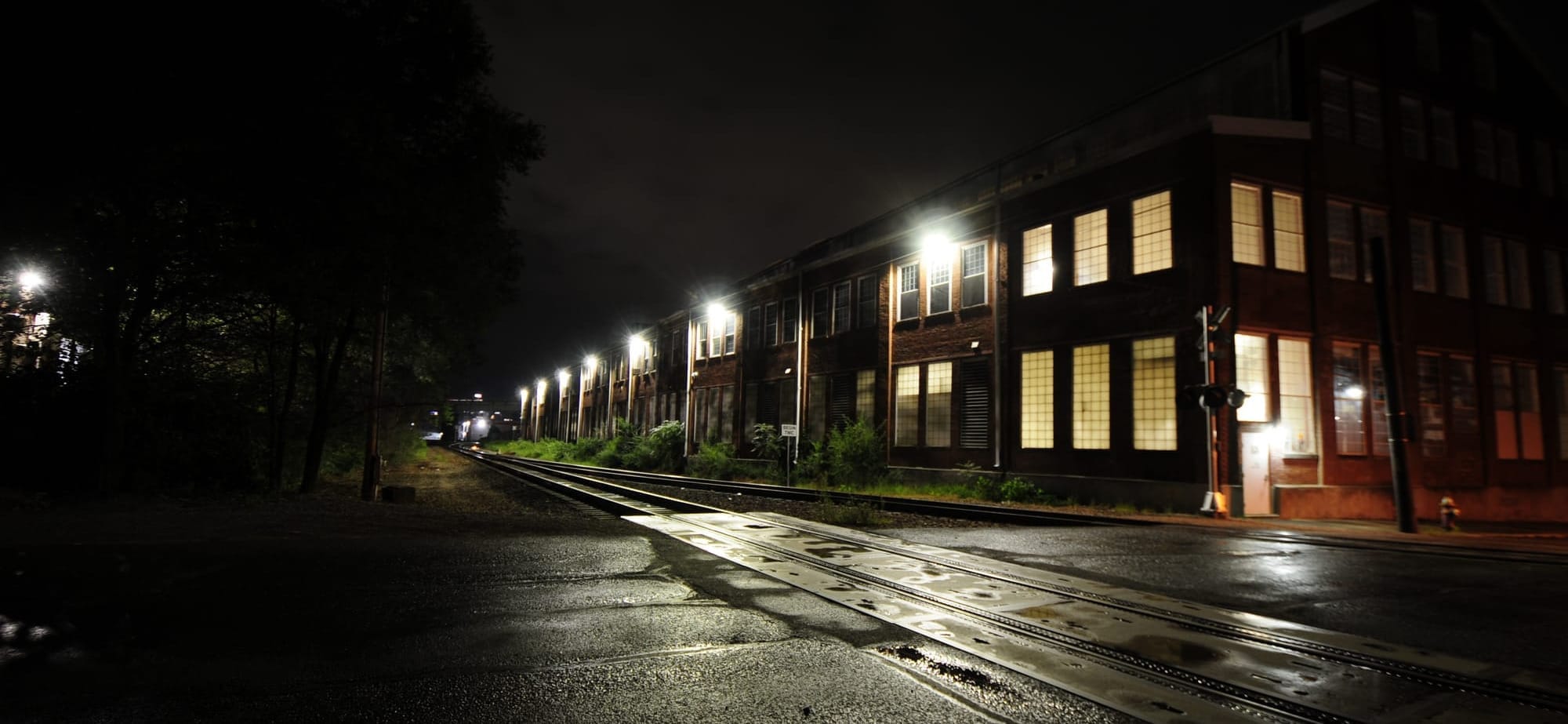 Warehouse At Night, lit by LEDs post-rainfall. 