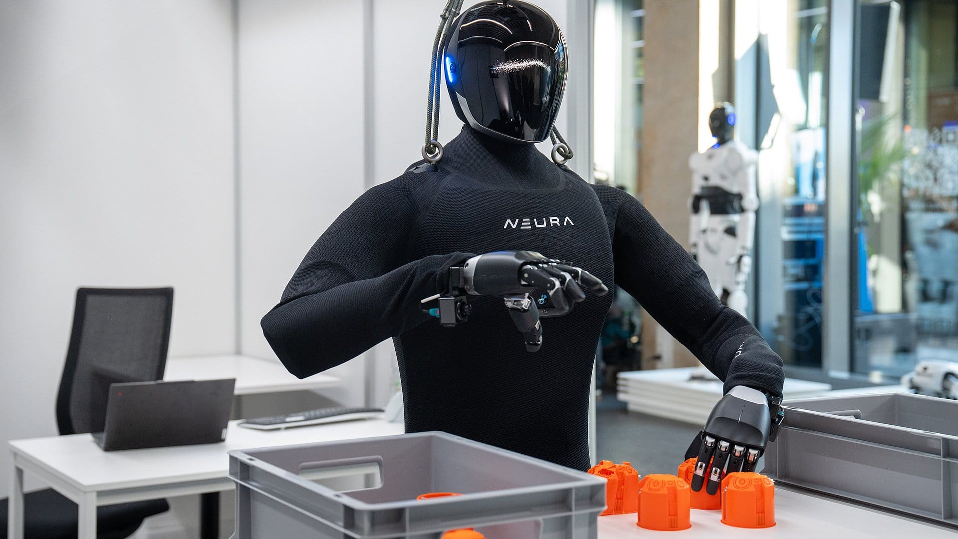 A humanoid robot identifies defective parts and sorts them into a container at the TUM RoboGym
