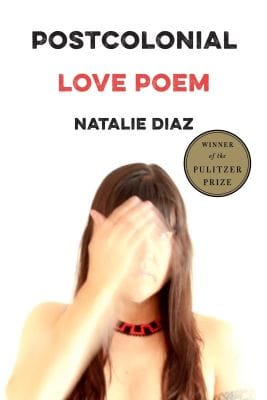 Cover of Postcolonial Love Poem by Natalie Diaz, featuring a blurry image of Diaz raising her hand in front of part of her face, against a white background