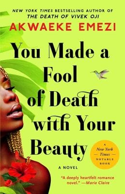Cover of You Made a Fool of Death with Your Beauty by Akwaeke Emezi, featuring a pale green background with shapes evocative of palm leaves and part of a Black person's face, upturned with lips and closed eye visible, in the lower left corner