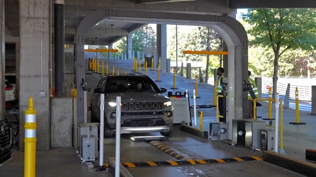 Hertz's new artificial intelligence-powered scanners are flagging customers for minor dents, scratches and blemishes in the company's rental cars.