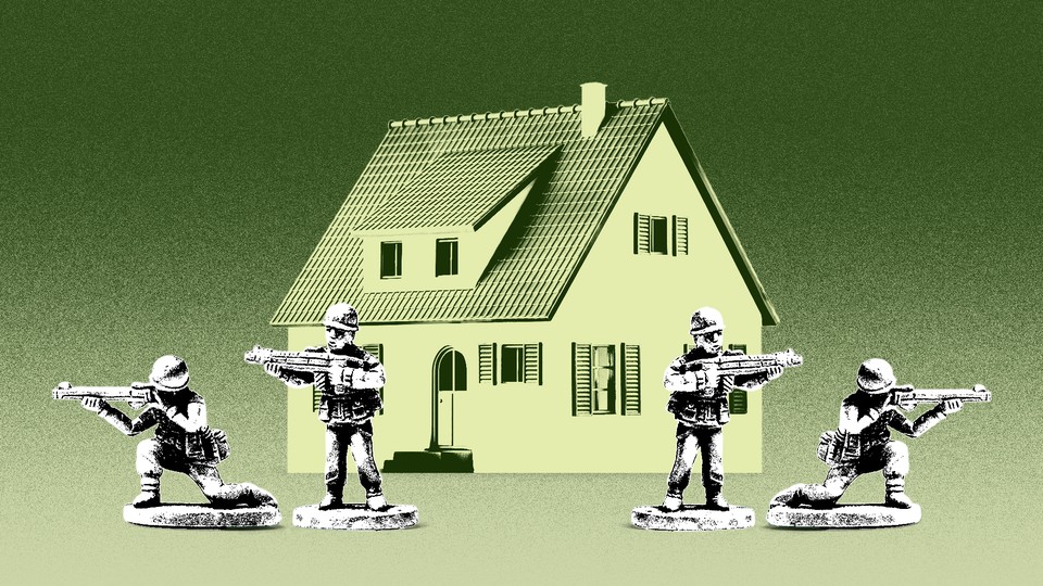 toy soldiers stationed in front of a house