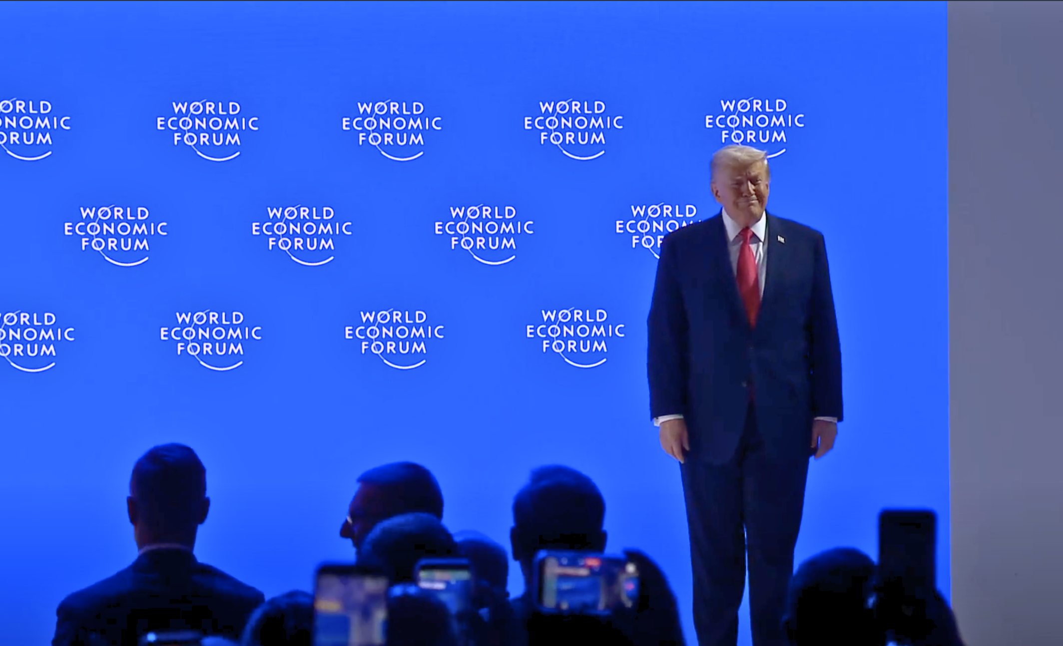 Donald Trump receives a standing ovation as he appears on the stage at the World Economic Forum annual meeting in Davos on January 21, 2026.