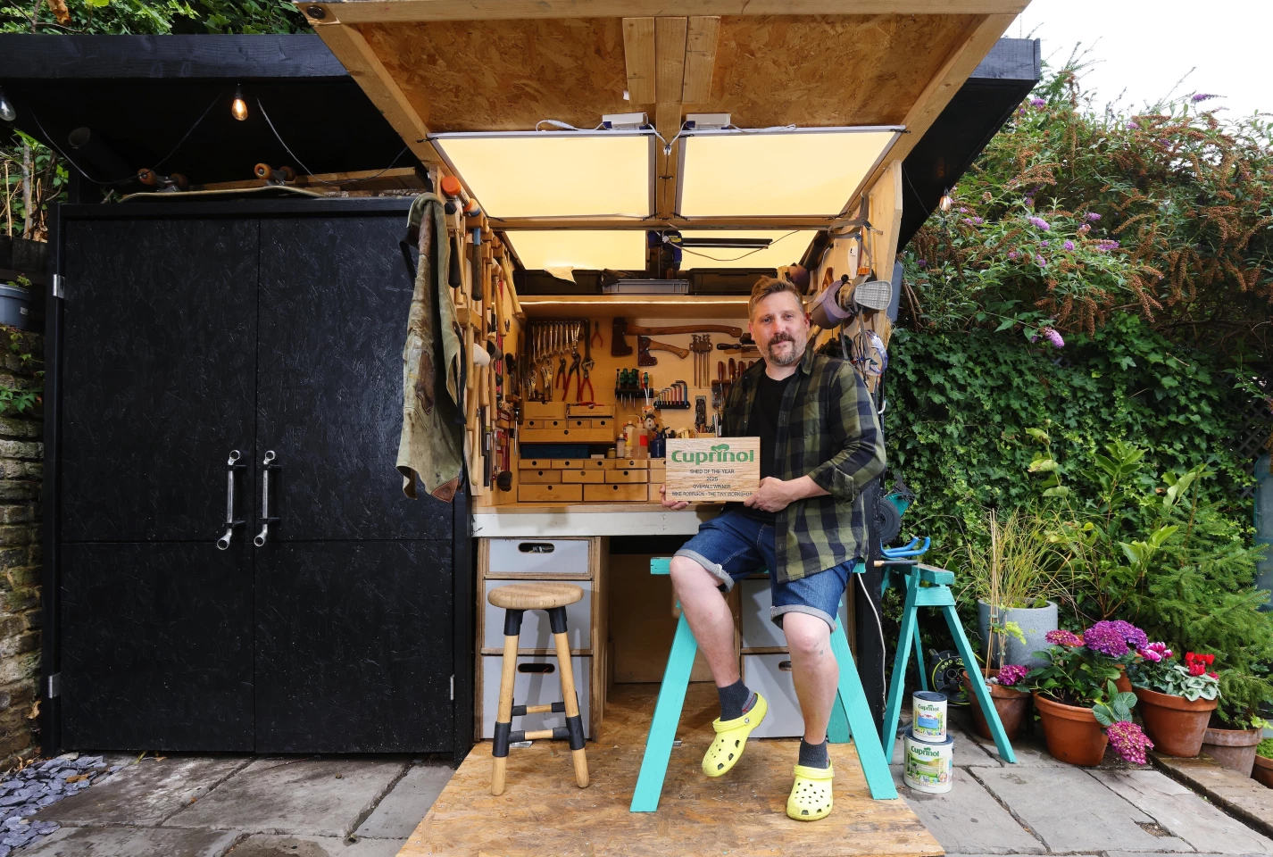 The Tiny Workshop was homemade from two sets of heavy duty steel shelving