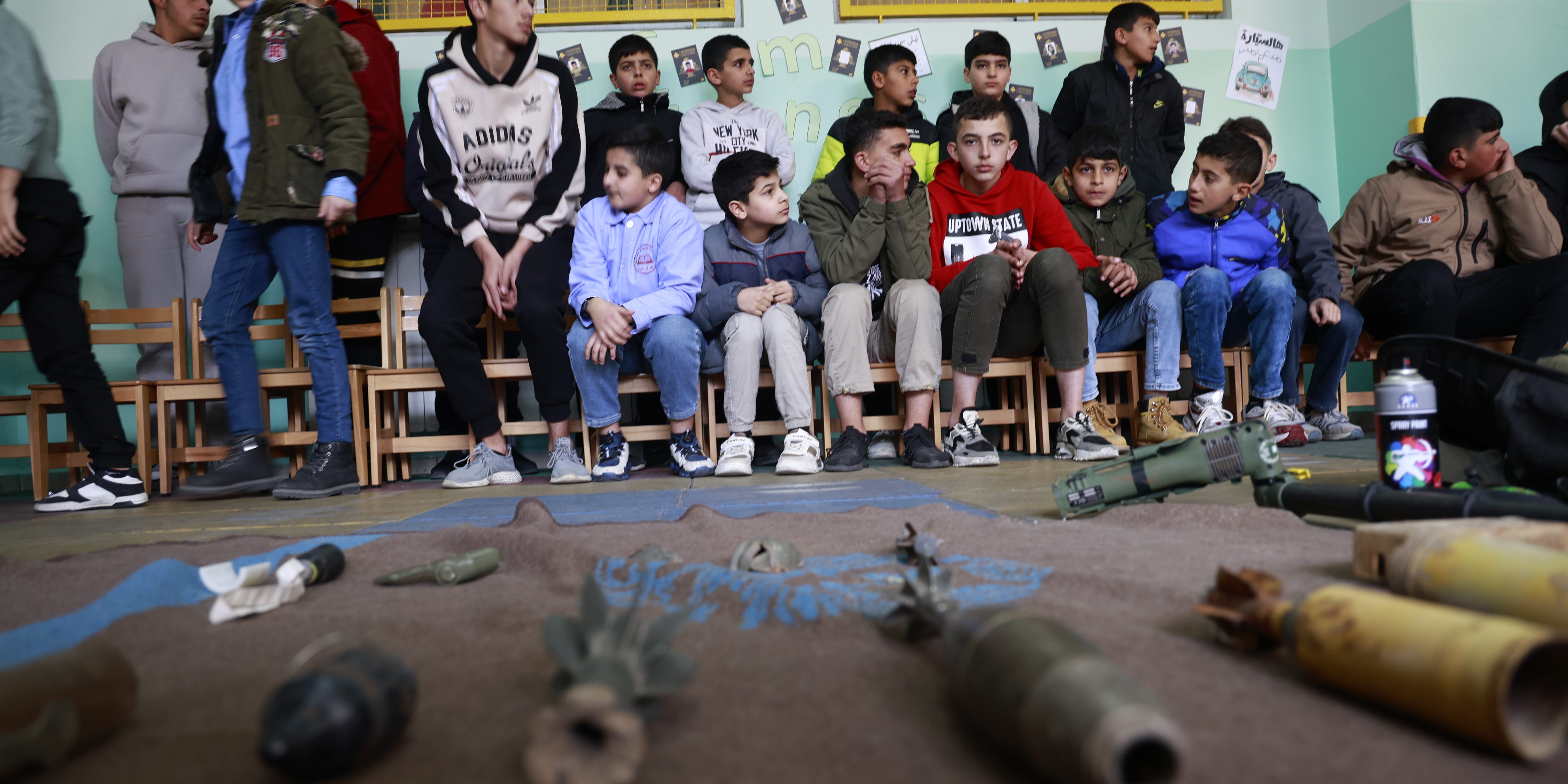 SHEBAA, LEBANON - JANUARY 21: Numerous students participate in a mine risk education event to raise awareness about the ongoing threat of landmines and unexploded ordnance left from past conflicts in Shebaa, Lebanon on January 21, 2026. Supported by the United Nations, these initiatives focus on clearing contaminated areas in southern Lebanon and educating civilians, especially children, about the dangers of remnants of war that continue to endanger local communities. The awareness session aims to reduce risks through interactive training, teaching participants how to recognize suspicious objects, avoid high-risk zones, and report potential hazards to authorities. (Photo by Ramiz Dallah/Anadolu via Getty Images)