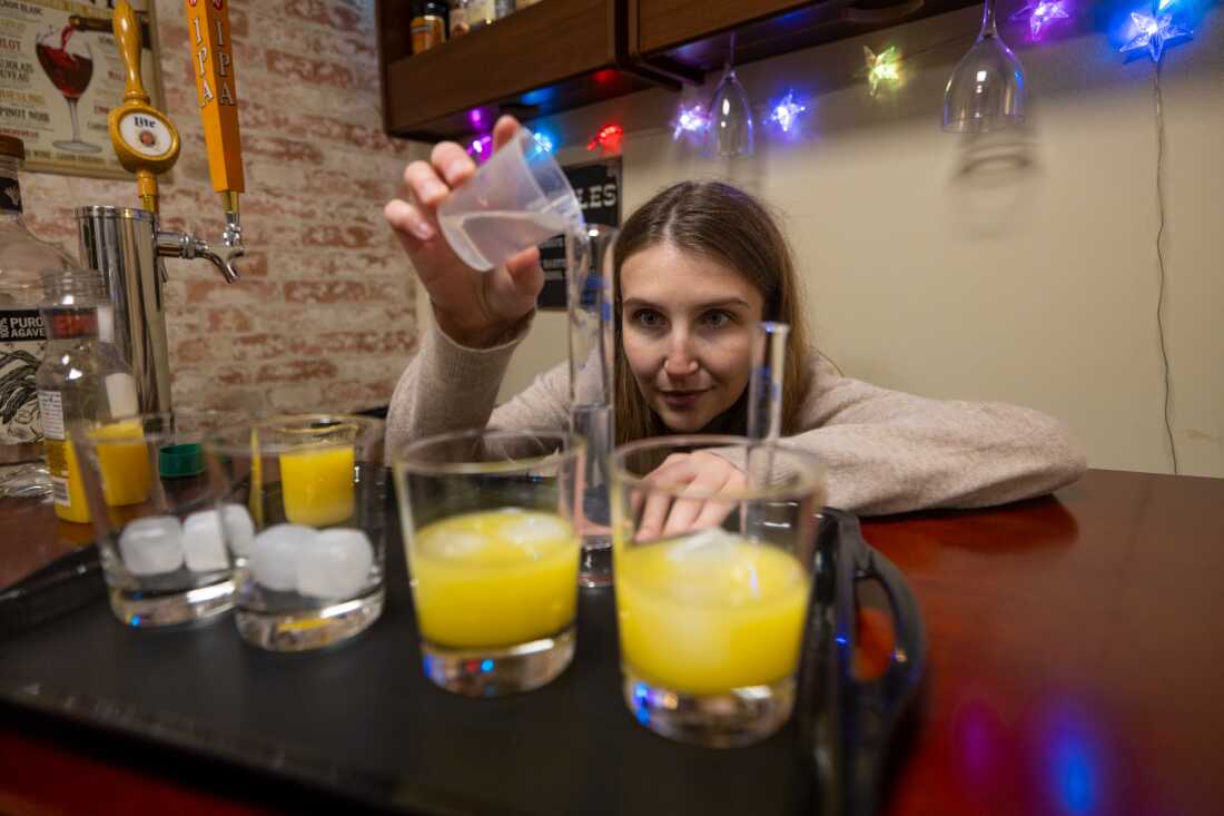 Hayley Buckey, who works in Jane Metrik's lab at Brown University measures alcohol as part of an experiment testing whether people drink less after they've smoked pot.