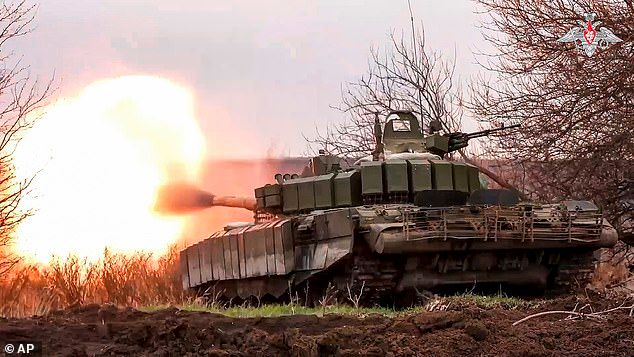 North Korea 'will send military personnel to Ukraine within a month' to boost Putin's forces - as Pyongyang warns of a 'new world war' after US aircraft carrier's arrival in the South
