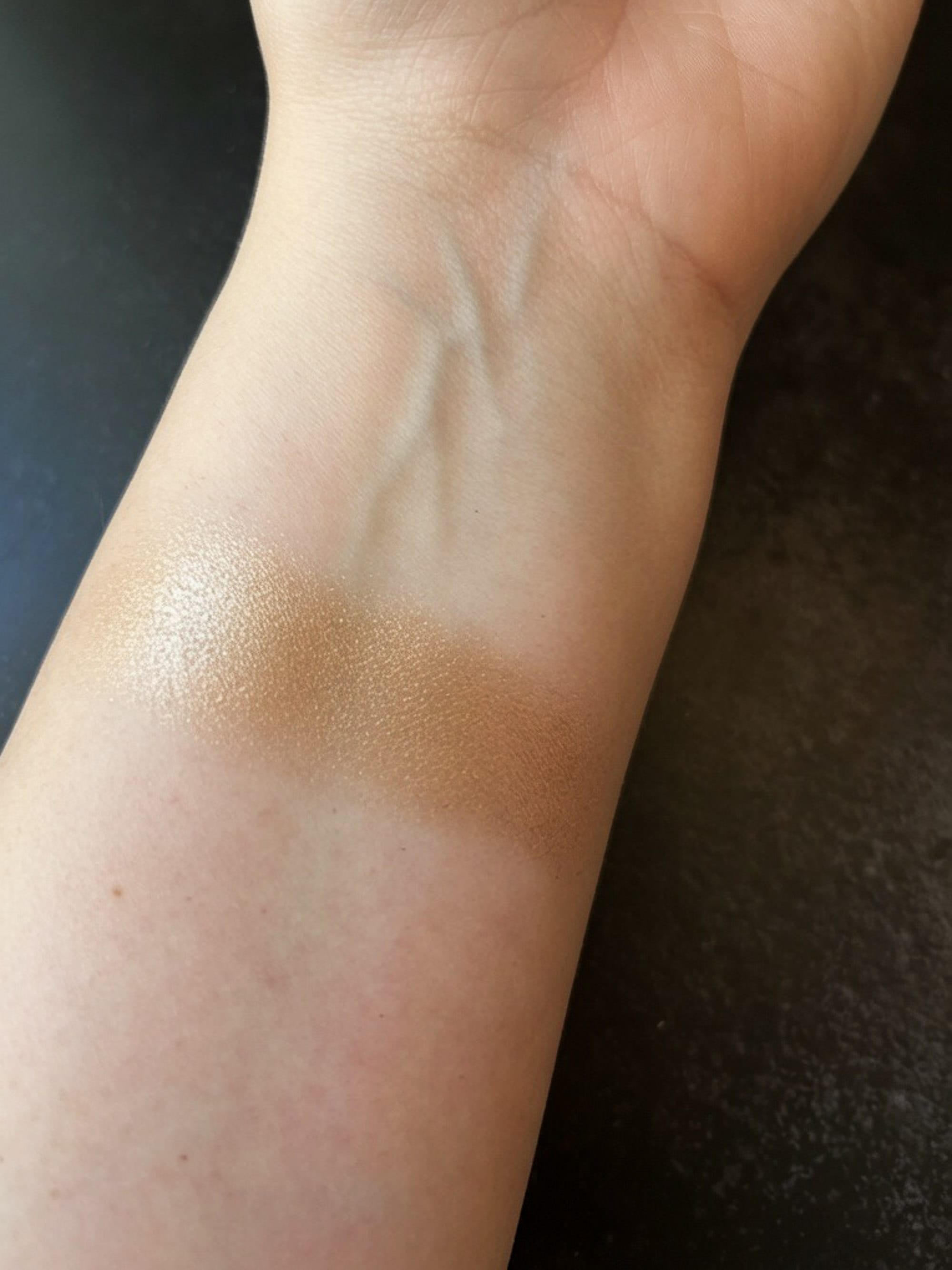 A swatch of Victoria Beckham Lid Lustre in the shade Honey, in natural light.