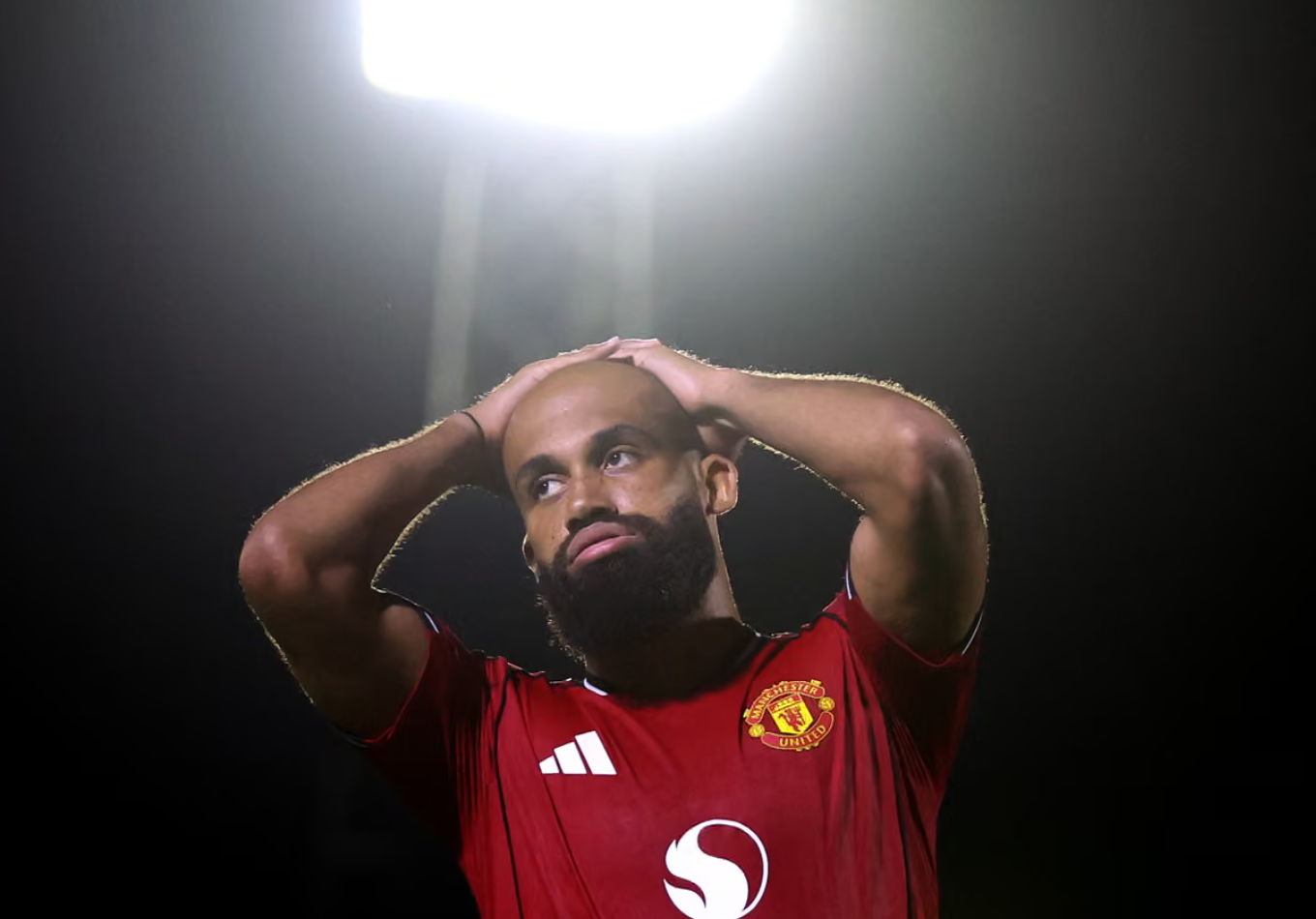 Manchester United player Bryan Mbeumo reacts with his hands on his heads after missing a penalty kick which meant his team lost the match