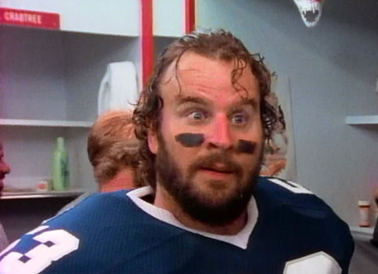 Donald Gibb as "Dr. Death," wearing a football uniform in the TV show "1st and Ten"