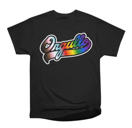 A black t-shirt with the word "Orgullo" written in rainbow-colored script on the front. The word Orgullo means "Pride" in Spanish