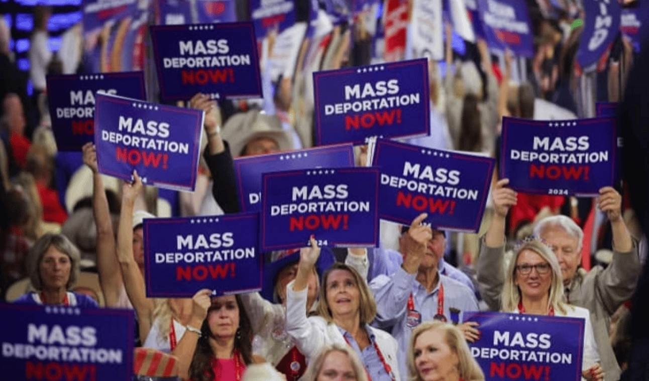 Delegates at the RNC holding up "Mass Deportation NOW!" signs.