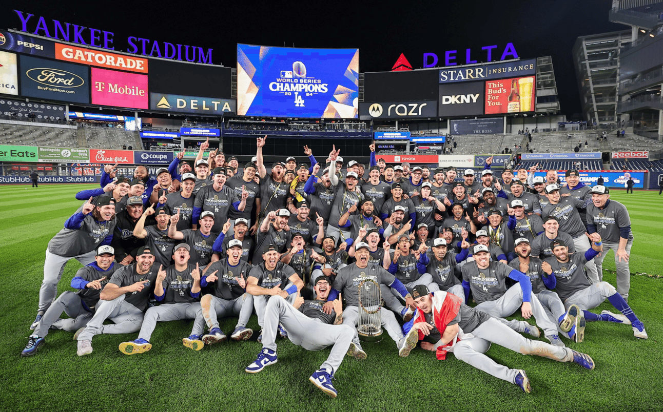 Dodgers assembling on the field with the World Series trophy after the game