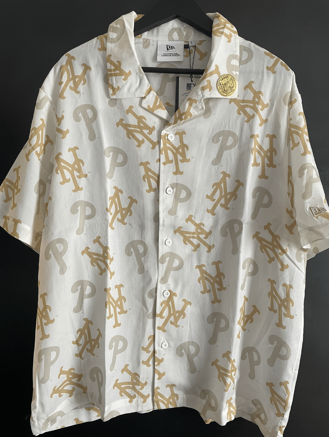Tommy Bahama-ass-lookin' short sleeve button up shirt from New Era with both Mets AND Phillies logos on it