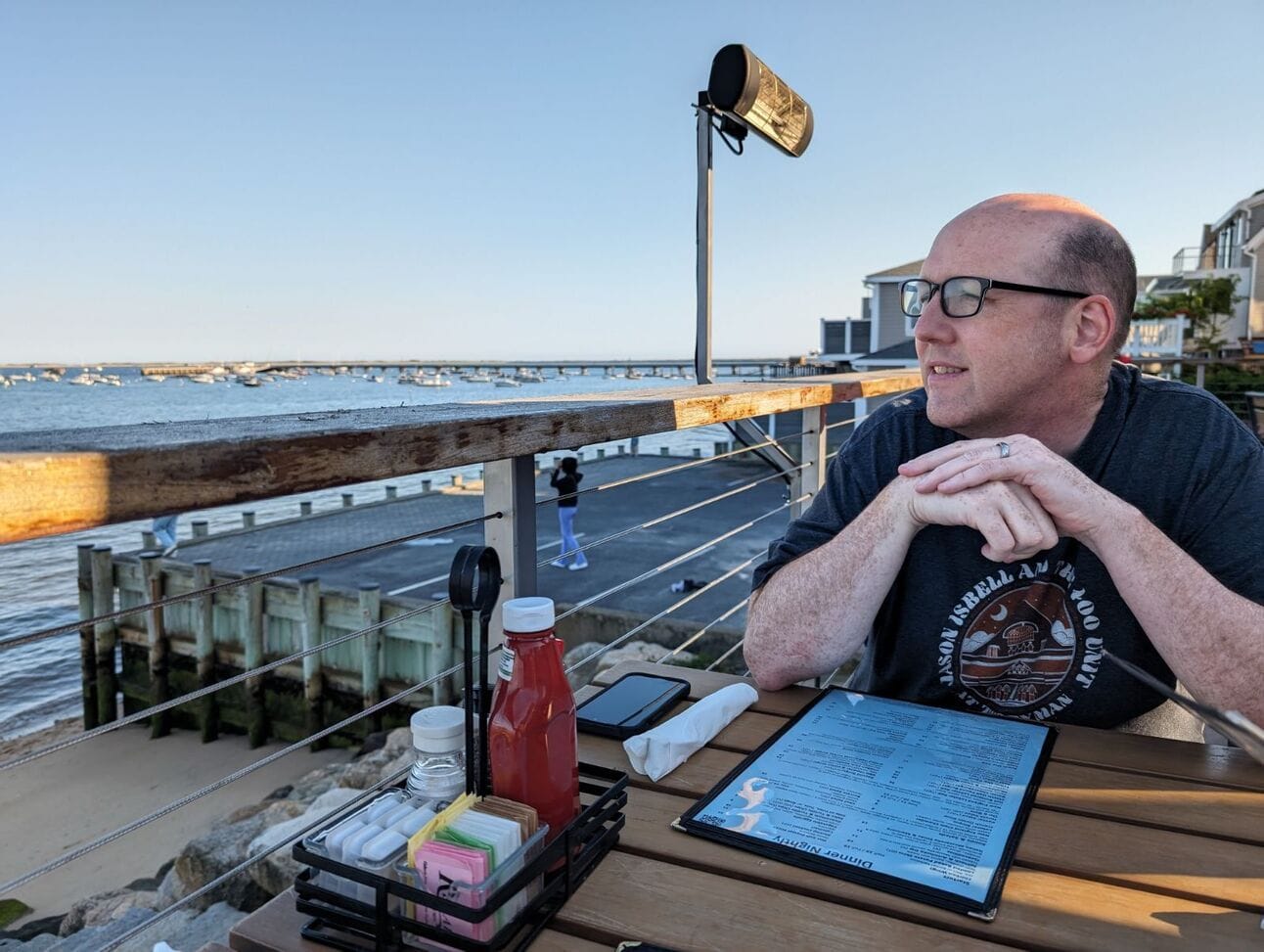 Craig contemplates a beer, a lobster roll, and tater tots