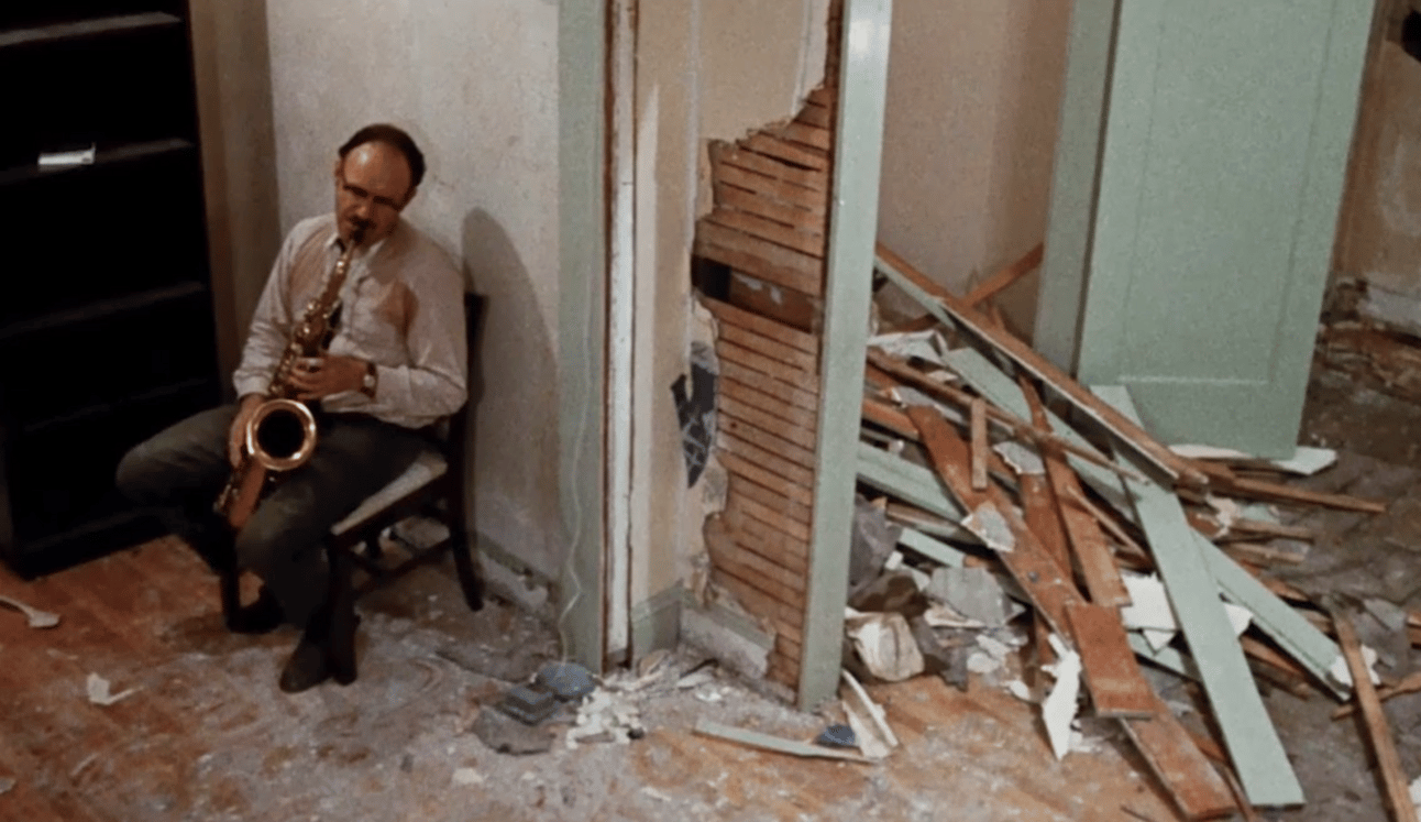Gene Hackman playing saxophone in a wrecked apartment in "The Conversation"