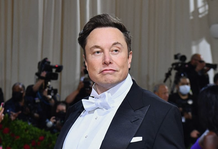 Elon Musk in a tuxedo, looking, as always, like the world's biggest dipshit. May he die in prison.