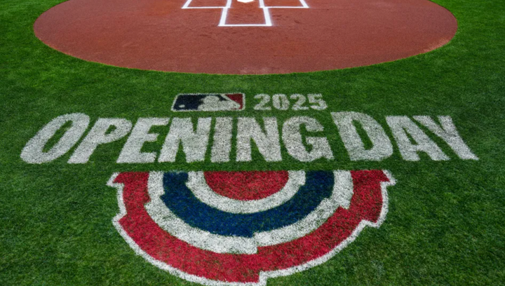 Opening Day 2025, spray painted on the grass behind home plate