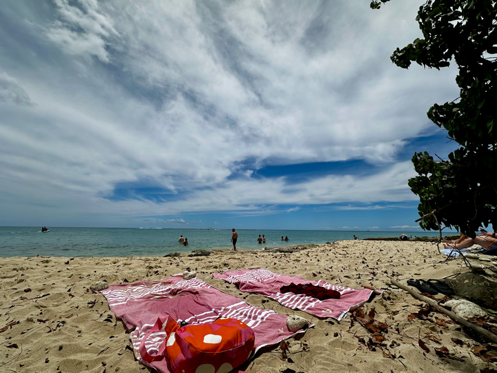 Two towels on a beach