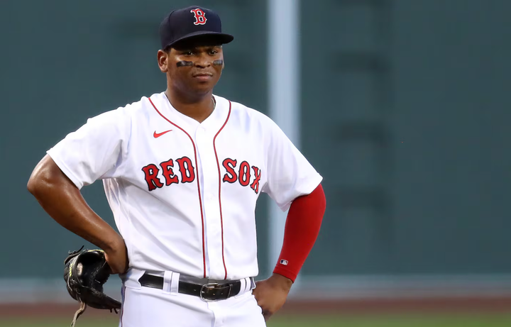 Rafael Devers with his hands on his hips