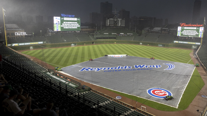 Wrigley Field with the tarp on in the rain. 