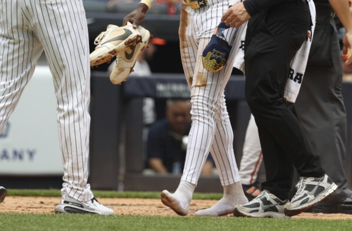 Jazz Chisholm Jr. with no shoes on after crossing home plate. 