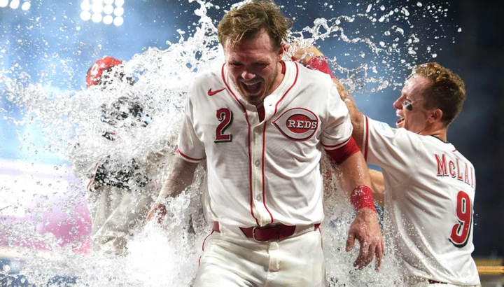 Reds player getting splashed with the water bucket after they won in walkoff fashion