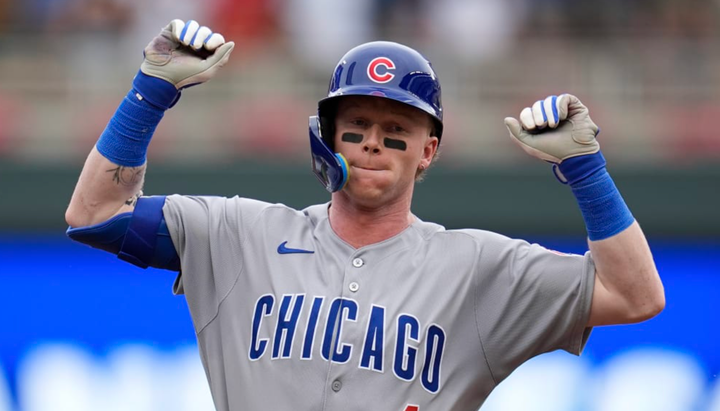 Pete Crow-Armstrong flexing his muscles I guess? I don't know what he's doing.