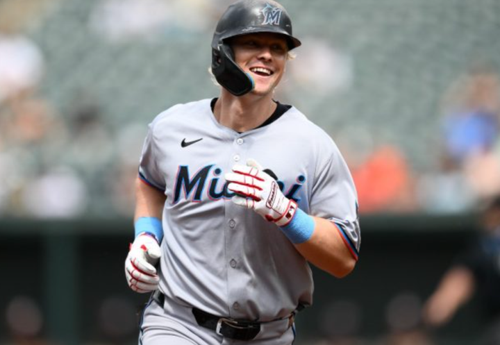 Kyle Stowers smiling as he rounds the bases following one of his three home runs