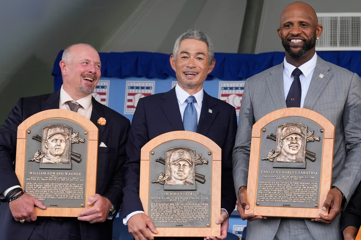 Billy Wagner, Ichiro, and CC Sabathia holding their Hall of Fame plaques yesterday