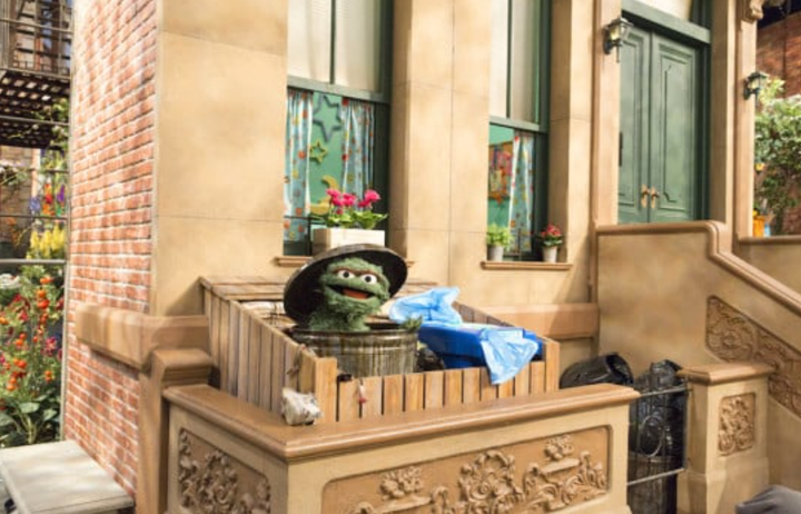 Oscar the Grouch in his can on the Sesame Street set