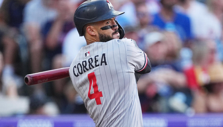 Carlos Correa swinging a bat