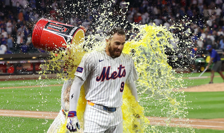 Brandon Nimmo getting a Gatorade shower from a teammate